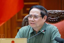 Prime Minister Pham Minh Chinh speaks at the meeting between standing Government members and representatives of ministries, agencies and Phu Tho province (Photo: VNA)