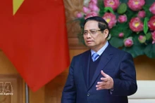 Prime Minister Pham Minh Chinh speaks at a meeting with a delegation of leaders from 37 member companies of the Japan Chamber of Commerce and Industry. (Photo: VNA)