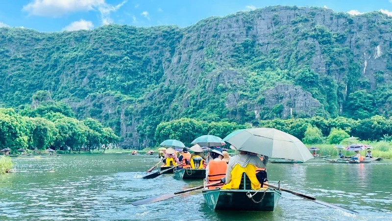 Tourists visit the Tam Coc tourist area in Ninh Binh Province. 
