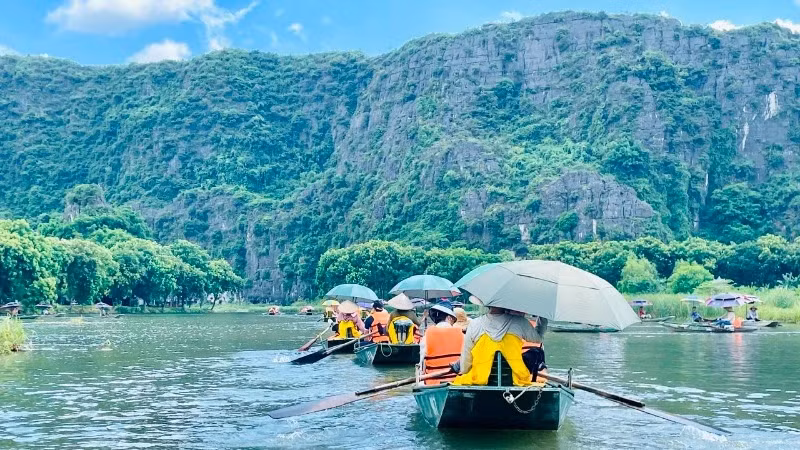 Tourists visit the Tam Coc tourist area in Ninh Binh Province. 