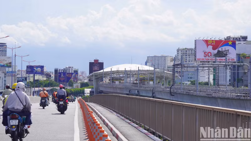 Saigon Bridge towards the centre of Ho Chi Minh City.