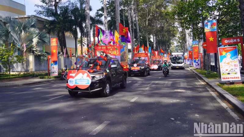 The red color of the national flag, promotional vehicles appears on the streets to celebrate the 50th anniversary of the Liberation of the South and National Reunification (April 30, 1975 - April 30, 2025).