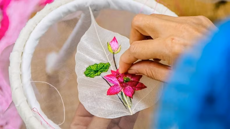 Embroidery on these delicate leaf skeletons requires technical precision and unwavering perseverance.