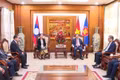 A delegation from the Lao People’s Revolutionary Party (LPRP) Central Committee's Inspection Commission, led by Deputy Chairwoman Pingkham Lasasimma, visits the Vietnamese Embassy in Vientiane to extend congratulations. (Photo: VNA)