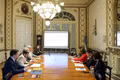 At the working session with representatives of Austral University (Photo: VNA)