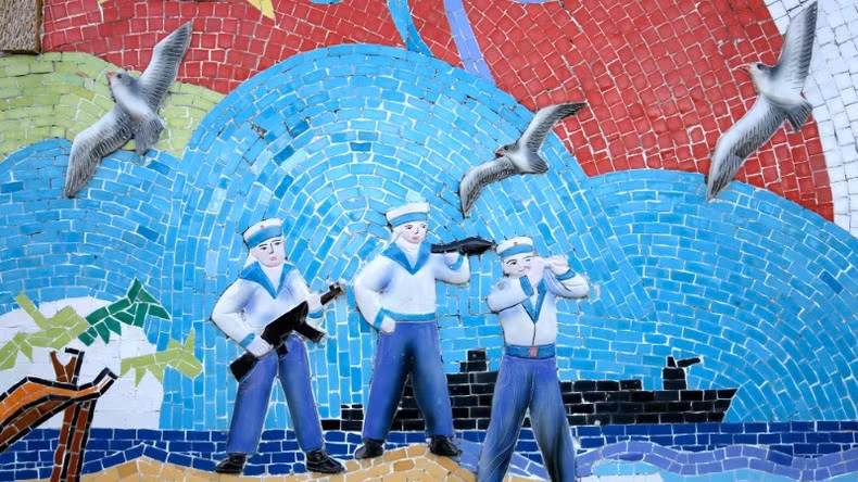A ceramic mural of Navy soldiers and seagulls. A ceramic mural of Navy soldiers and seagulls.