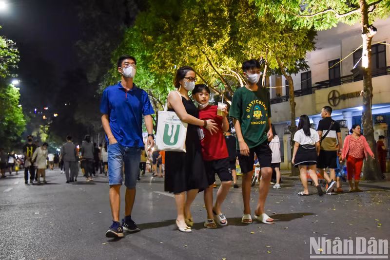 People stroll around the historic area enjoying the fine weather and taking part in various games.