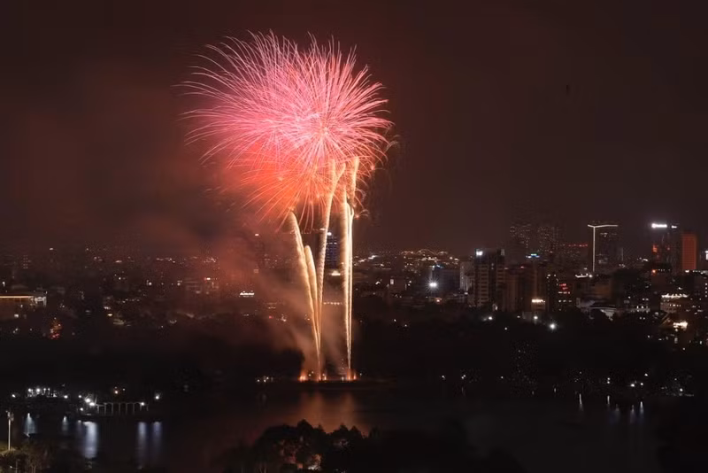 Fireworks explode over Thong Nhat Park. Fireworks explode over Thong Nhat Park.