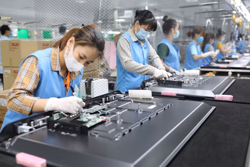 Manufacturing electronic parts at an industrial park in Quang Ninh Province.
