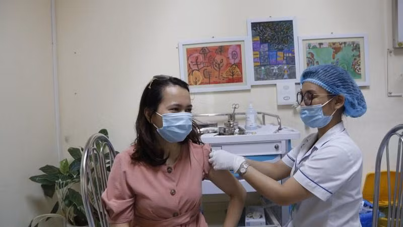 A woman is vaccinated against COVID-19.