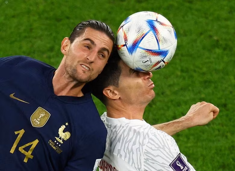 France's Adrien Rabiot in action with Poland's Robert Lewandowski. REUTERS/Lee Smith