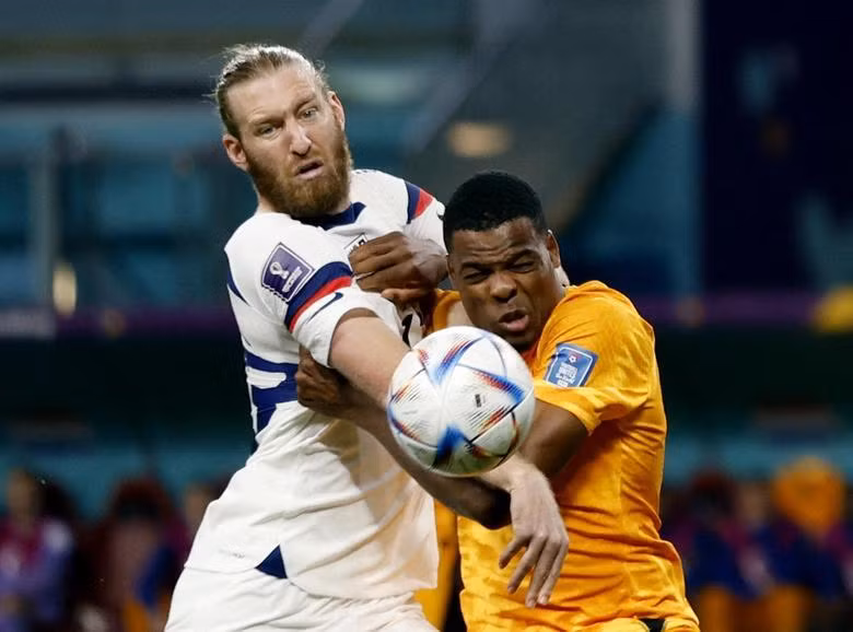 Tim Ream of the U.S. in action with Netherlands' Denzel Dumfries. REUTERS/John Sibley