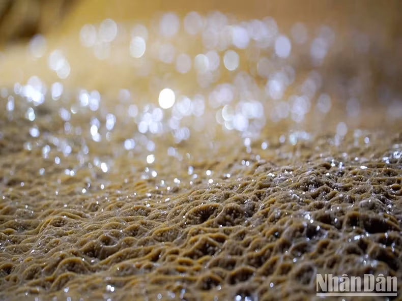 The yellow stalactites in the cave.