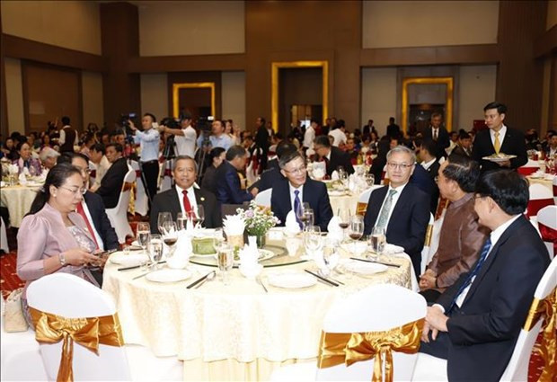 At a gathering in Laos (Photo: VNA)