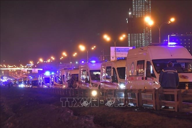 Ambulances are seen near Crocus City Hall following a shooting incident in the northwest of Moscow, Russia, on March 22. (Photo: Xinhua/VNA)