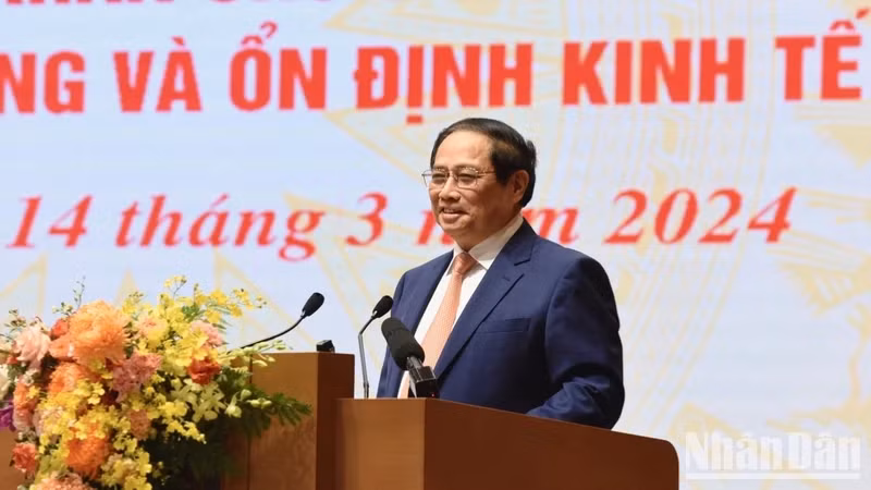 PM Pham Minh Chinh speaks at the conference held on March 14 to launch monetary policy-related tasks for this year. (Photo: NDO)