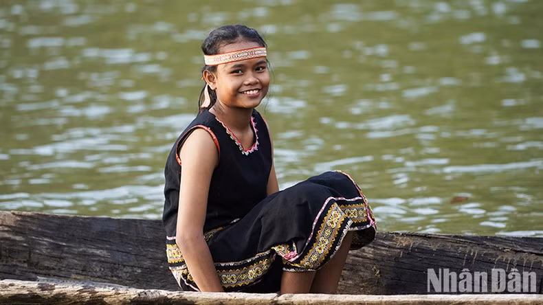 The beauty of a Ba Na child on the poetic Dak Bla River. The beauty of a Ba Na child on the poetic Dak Bla River.