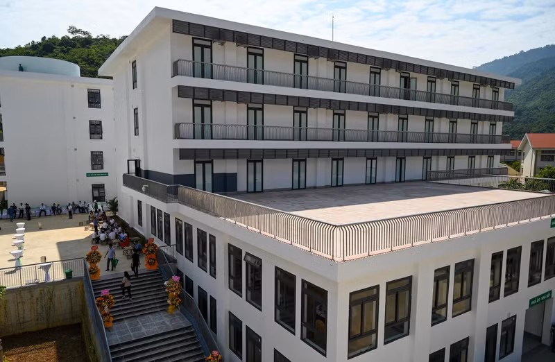 Canteen and kitchen areas and boarding houses for students at Ky Son High School