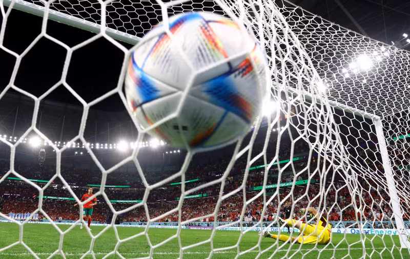 Morocco's Abdelhamid Sabiri scores a penalty during the penalty shootout. (Photo: REUTERS)