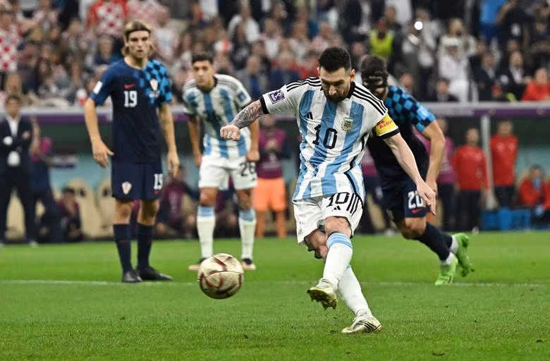 Argentina's Lionel Messi scores their first goal from the penalty spot. (Photo: REUTERS)