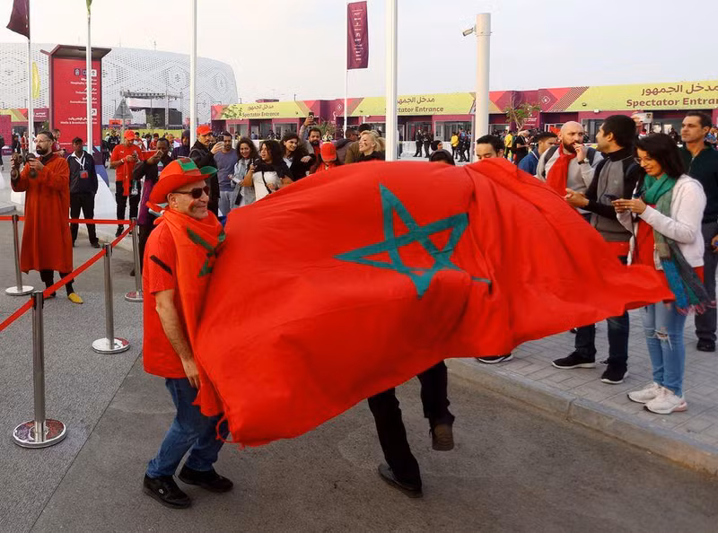 Morocco fans are pictured with the flag of Morocco outside the stadium before the quarter final match between Morocco and Portugal. (Photo: REUTERS)