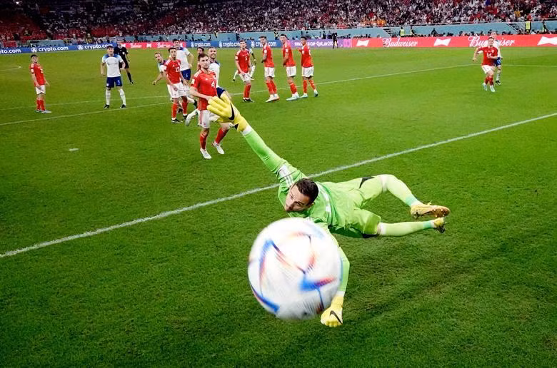 England's Marcus Rashford scores their first goal from a free kick past Wales' Danny Ward. (Photo: REUTERS)