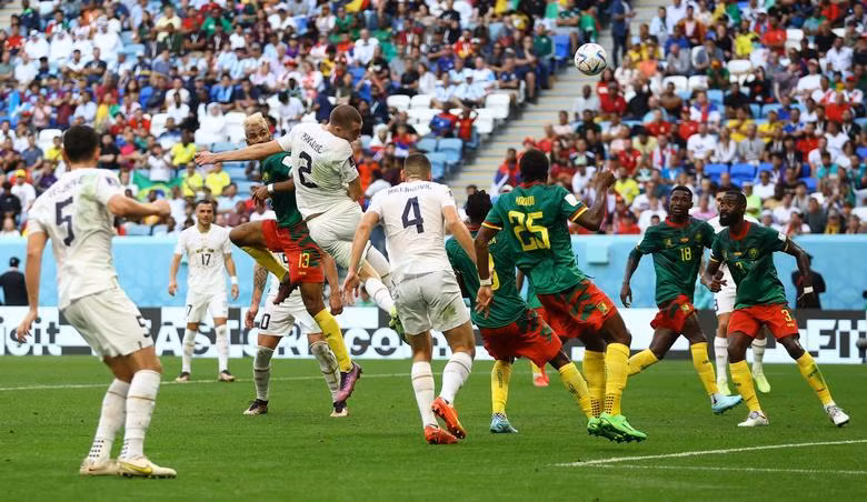 Serbia's Strahinja Pavlovic scores their first goal against Cameroon. (Photo: REUTERS)