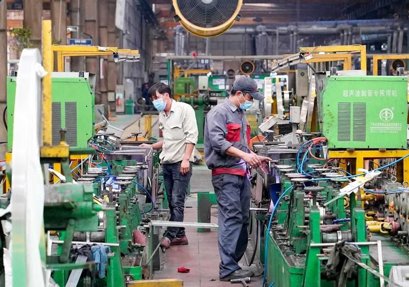Stainless steel pipe production line at Son Ha International Joint Stock Company, Phung Industrial Park in Hanoi. (Photo: DUY DANG)