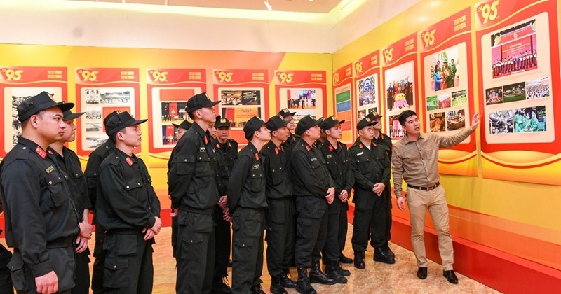 Members of the Mobile Police Force under the Hanoi Police visit the exhibition.