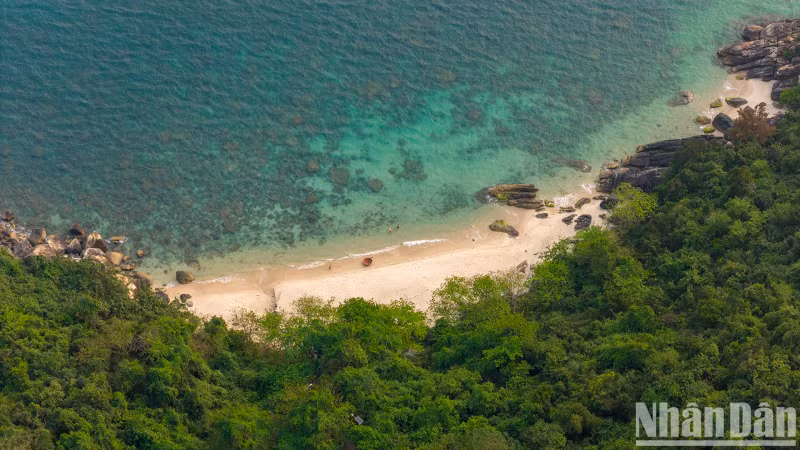 The stunning white sand beach, viewed above, reveals its pristine beauty.
