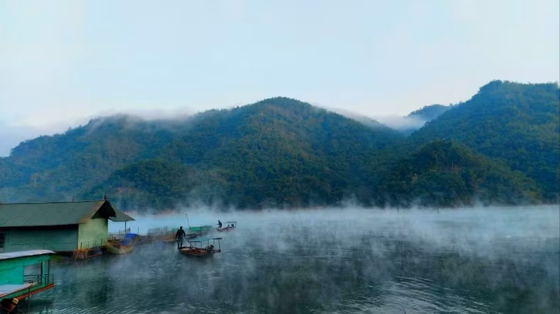 The misty landscape of Hoa Binh Lake.