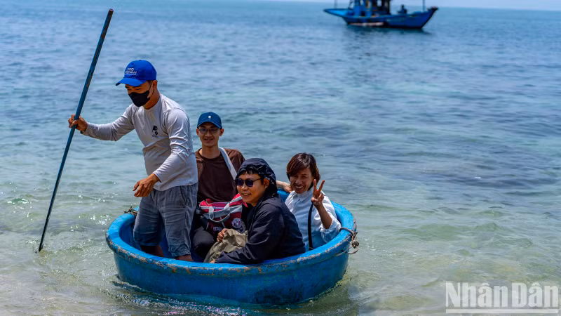 Visitors travel by a coracle.