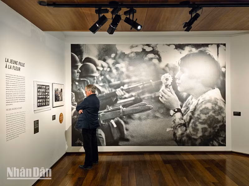 The photo titled “A Girl with a Flower” has become a symbol of the anti-war spirit, illustrating the stark contrast between beauty and brutality, life and death, peace and war.