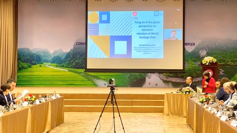 Dr. Enrico Eraldo Bertacchini delivers a presentation focusing on the economic valuation of world heritage sites and positioning Trang An within the global context.
