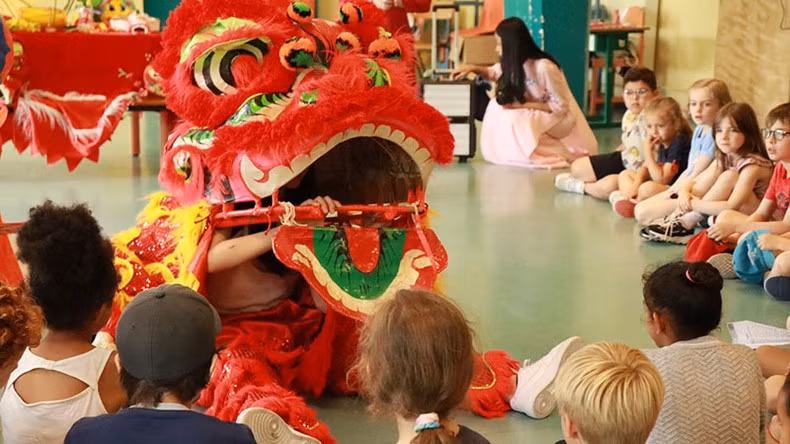 Children watching 'mua lan' (dragon dance)