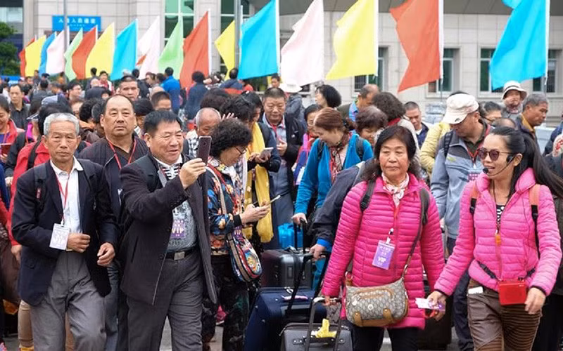 Chinese tourists enter Vietnam through Mong Cai border gate (in Quang Ninh) before the outbreak of the pandemic. (Photo: Hoai Nam)