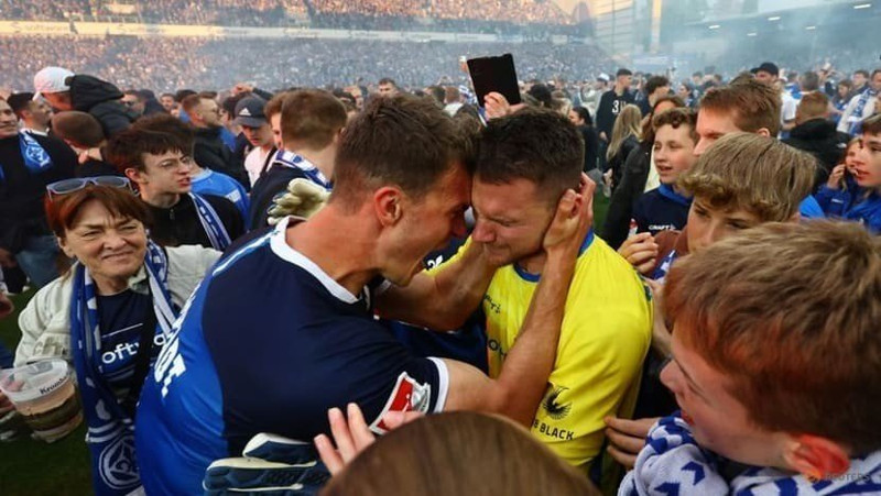 Bundesliga - SV Darmstadt 98 v FC Magdeburg - Merck-Stadion am Bollenfalltor, Darmstadt, Germany - May 19, 2023 SV Darmstadt 98's Marcel Schuhen and Christoph Zimmerman celebrate after securing promotion to the Bundesliga. (Photo: Reuters)
