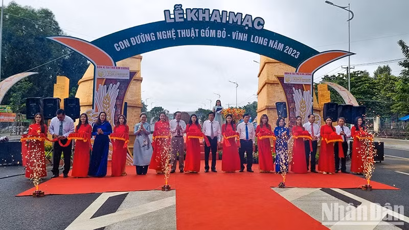 The ribbon cutting ceremony for the opening of the red ceramic street. 