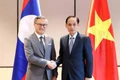 Vietnamese Foreign Minister Le Hoai Trung (R) and his Lao counterpart Thongsavanh Phomvihane at the 12th Viet Nam–Laos political consultation at the foreign ministerial level in Ha Noi on December 18, 2025 (Photo: VNA)
