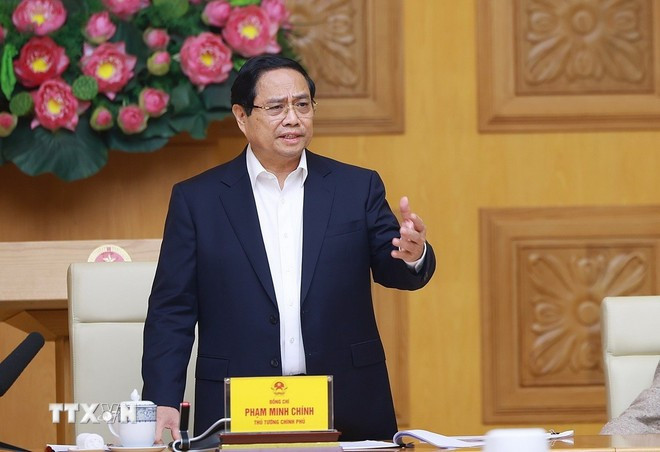 Prime Minister Pham Minh Chinh speaks at a meeting on accelerating Quang Trung Campaign. (Photo: VNA)