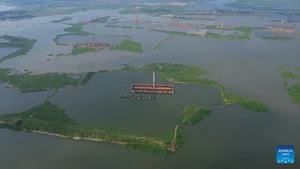 An aerial drone photo taken on Oct. 25, 2025 shows some brickyards half submerged in floodwater in Dhaka, Bangladesh. Heavy rainfall and rising river levels have submerged low-lying areas around the capital including some brickyards. (Photo: Xinhua)