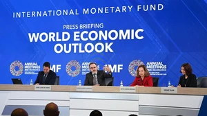 The International Monetary Fund (IMF) chief economist Pierre-Olivier Gourinchas (2nd L) speaks at a press briefing on World Economic Outlook in Washington, D.C., the United States, Oct. 14, 2025. IMF on Tuesday raised its global economic growth for 2025 to 3.2 percent, 0.2 percentage point higher than the July forecast, the latest World Economic Outlook report said. (Photo: Xinhua)