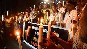 People holding lit candles mourn the victims of the Air India plane crash in Bhopal, the capital city of India's Madhya Pradesh state, June 13, 2025. According to the latest media reports, a total of 265 dead bodies had already been brought to a local government hospital in Ahmedabad city, where the plane crash had taken place. Among the dead were 241 people onboard the ill-fated Boeing aircraft, while the rest of the casualties took place on the ground. (Photo: Xinhua)
