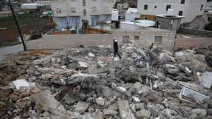 A Palestinian checks the rubble of a house demolished by the Israeli forces in the city of Hebron, southern West Bank, on Jan. 15, 2026. Israeli authorities arrested 80 Palestinians, demolished a house, and barred the Palestinian Authority's minister of Jerusalem affairs from entering the West Bank, according to Palestinian sources on Thursday. (Photo: Xinhua)