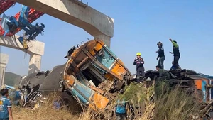 This photo taken with a phone on Jan. 14, 2026 shows the accident site after a crane collapse derailed a passenger train in Sikhio District, Thailand's Nakhon Ratchasima Province. At least 22 people were killed and 55 others injured after a passenger train collided with a collapsed construction crane in northeastern Thailand's Nakhon Ratchasima province on Wednesday, local media reported. (Xinhua)
