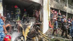 Firefighters work at the site of the crash in Dhaka, Bangladesh, on July 21, 2025. At least 19 people, mostly students, were killed as a training aircraft of the Bangladesh Air Force crashed on the campus of a college here on Monday. A government statement said that over 100 people were injured in the accident. Many of the injured are in critical condition. The Inter Service Public Relations (ISPR) of the Bangladesh Army said the training aircraft crashed at around 13:30 local time. (Photo: Xinhua) 