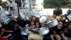 Palestinians wait to receive food in the Al-Rimal neighborhood of central Gaza City, on July 20, 2025. The total death toll of hunger in Gaza since March has reached 86, including 76 children, the Gaza-based health authorities said Sunday. (Photo: Xinhua)