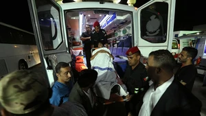 A sick child from Gaza arrives at the King Hussein Bridge border crossing, Jordan, on July 16, 2025. The Jordan Armed Forces on Wednesday evacuated the seventh group of sick children from the Gaza Strip under the Jordanian Medical Corridor initiative, according to a military statement. The group included 35 children, accompanied by 72 family members. They were transported to Jordan for treatment in local hospitals via the King Hussein Bridge. (Photo: Xinhua)