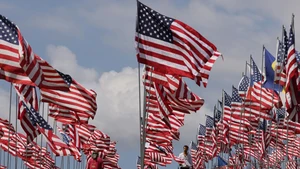 People walk among the Waves of Flags at Pepperdine University in Malibu, California, the United States, on Sept. 10, 2025. Each September, the university stages the Waves of Flags display to honor the victims of the 9/11 attacks. (Photo: Xinhua) 