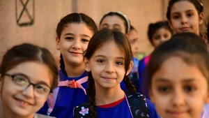 Students pose for a photo on the first day of new academic year in Damascus, Syria, on Sept. 21, 2025. The new academic year began with about 12,000 schools open on Sunday across the country. (Photo: Xinhua)